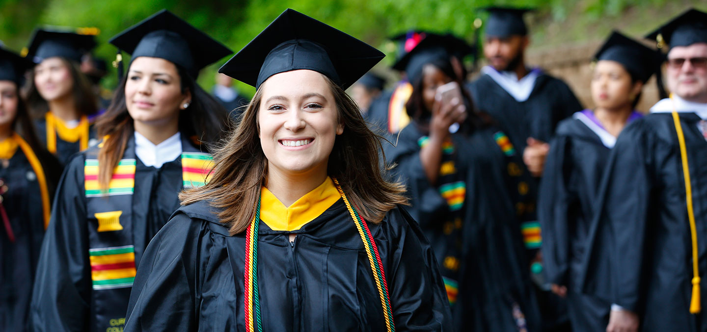 A Ƶ student walks on Commencement representing the Curry Fund