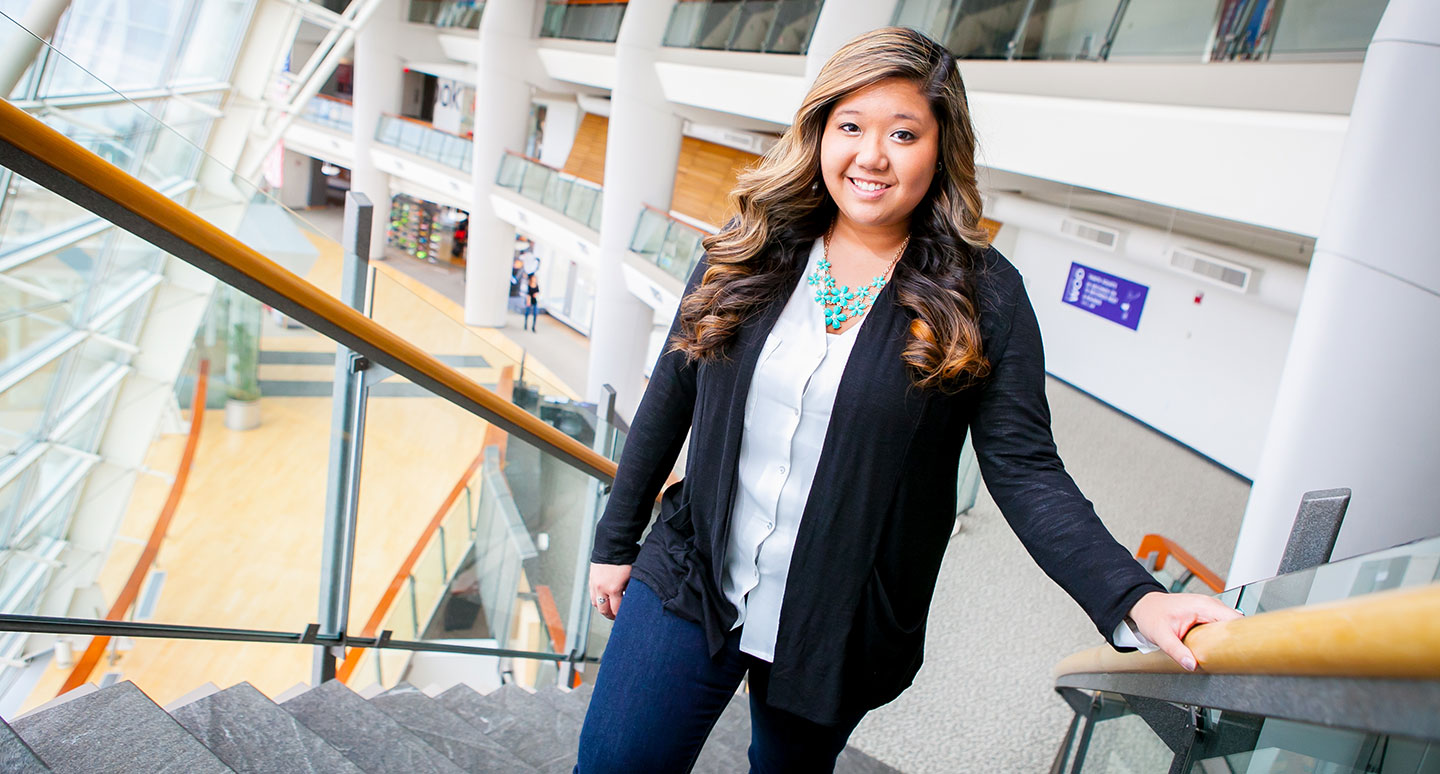 Recent Ƶ graduate Christine Nguyen '14 walks up the stairs at her place of employment