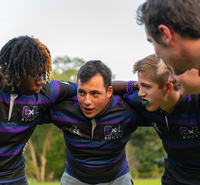 Ƶ Men's Rugby players in a huddle